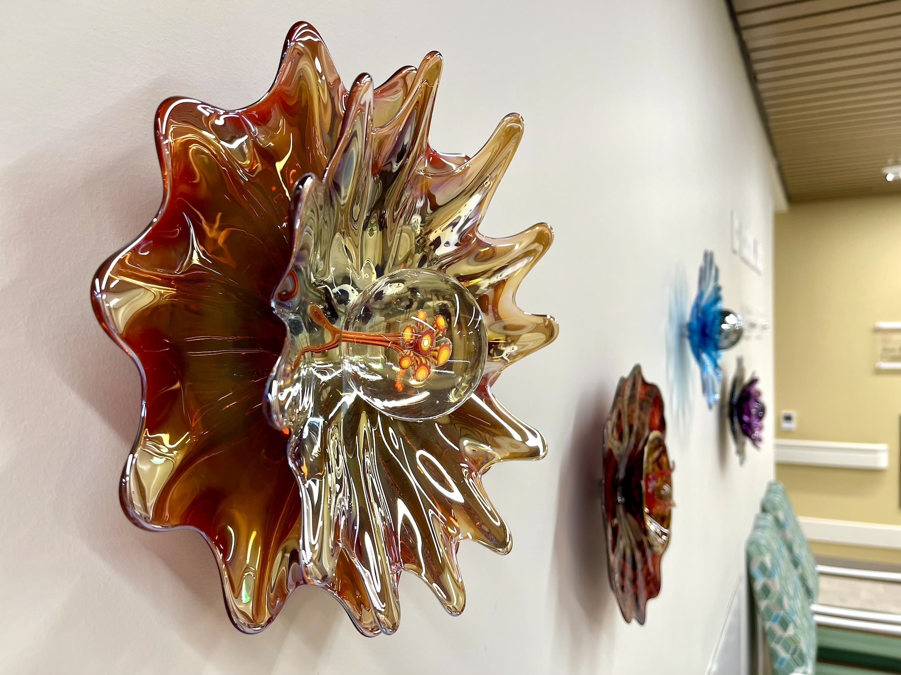 decorative blown glass blossoms designed to be a beautiful and calming source of interest for an Alzheimers care facility